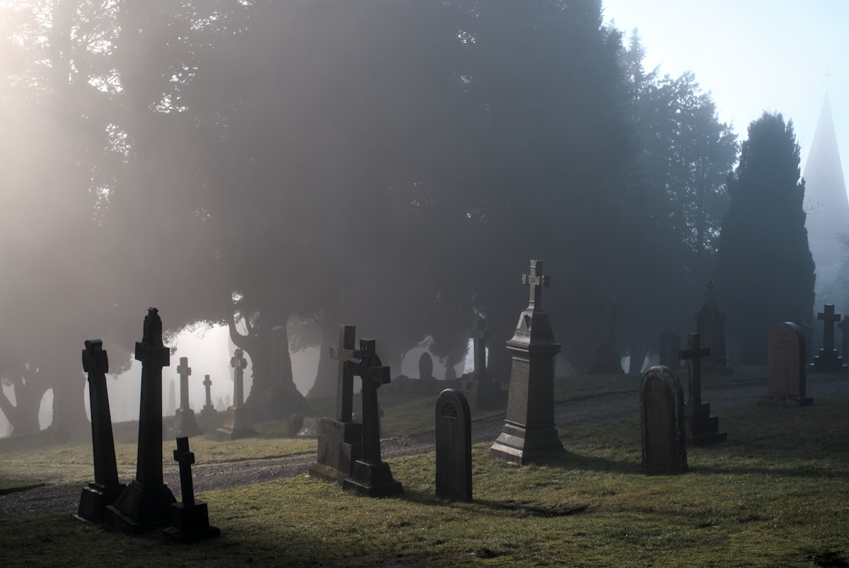 Foggy cemetery with tombstones